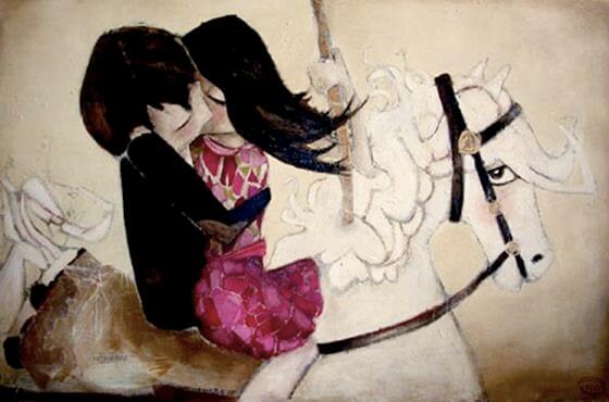 キスをする白馬に乗ったカップル