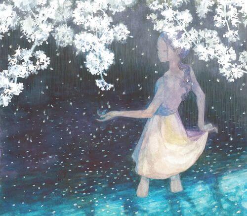 花の下の水の中に立つ少女