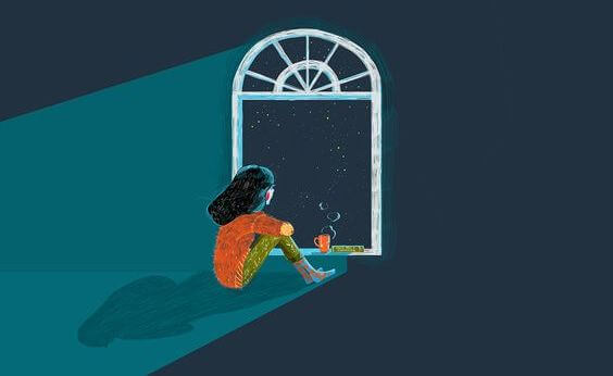 窓から夜空を眺める少女