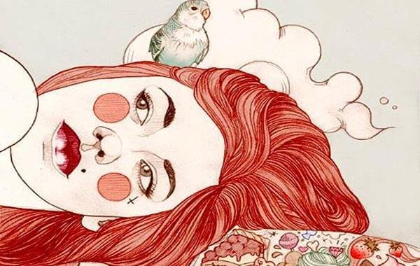 赤毛の女性とインコ