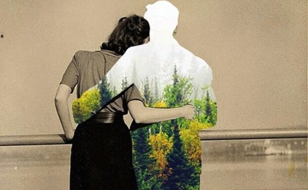 森が映った男性の影と抱き合う女性