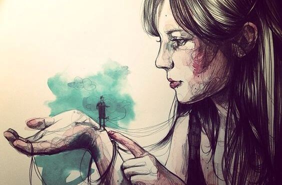 女性の手の上の男性