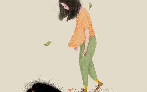 うつむいて歩く女性