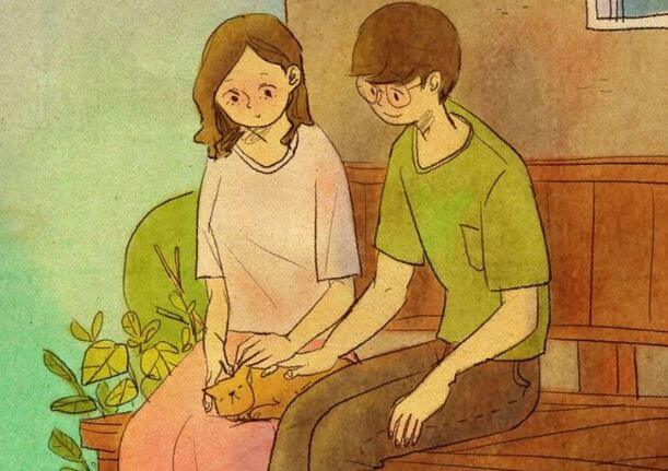 猫をなでるカップル