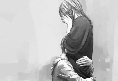 泣く女性をハグ