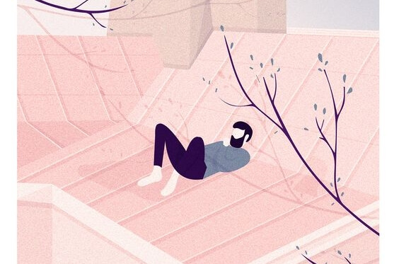 屋根の上に寝る男性