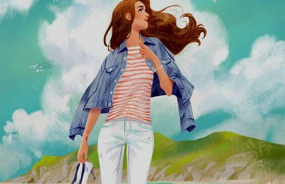 靴を片手に持って歩く女性