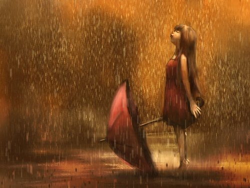 傘を置いて雨に濡れる少女