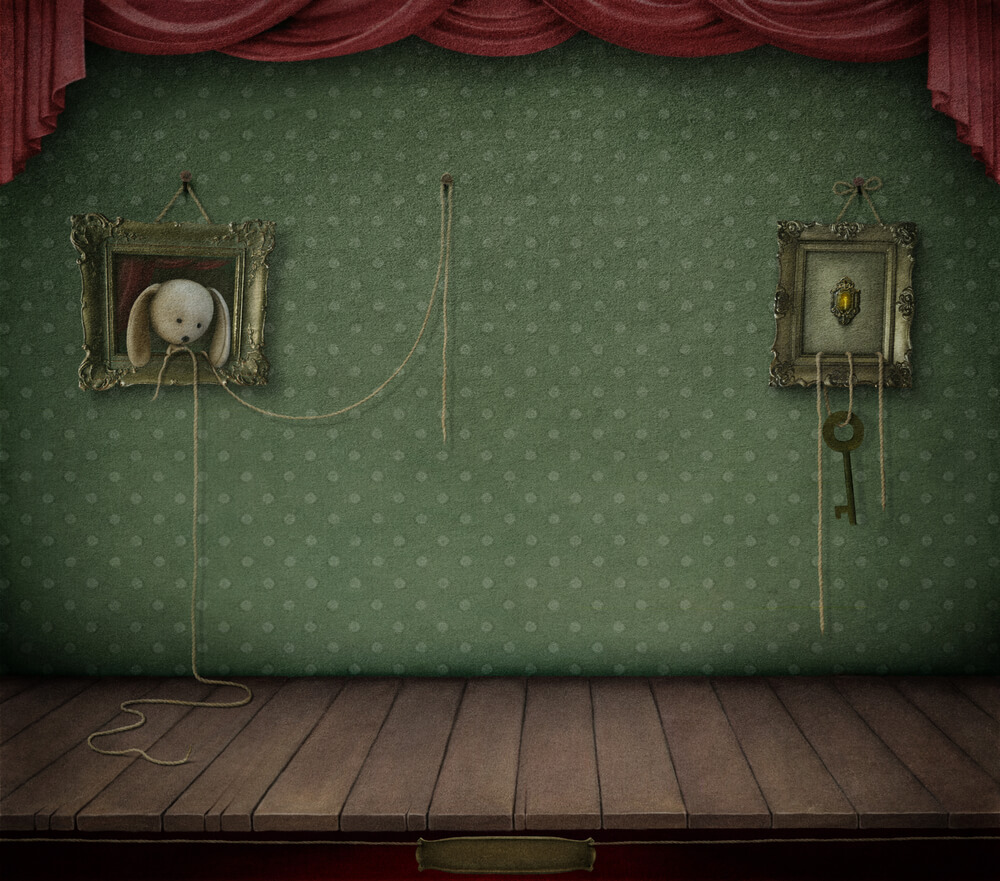 壁の絵から顔を出す犬