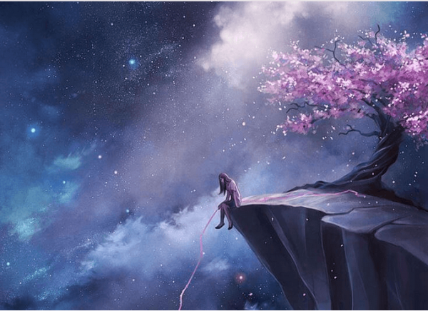 桜の咲く崖に座る女性