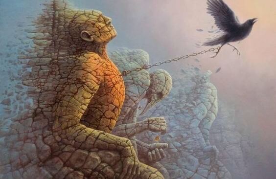 鳥に引っ張られる石像