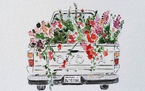 花がたくさん積まれたトラック