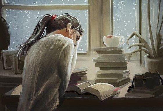 本の山の中で勉強する女性